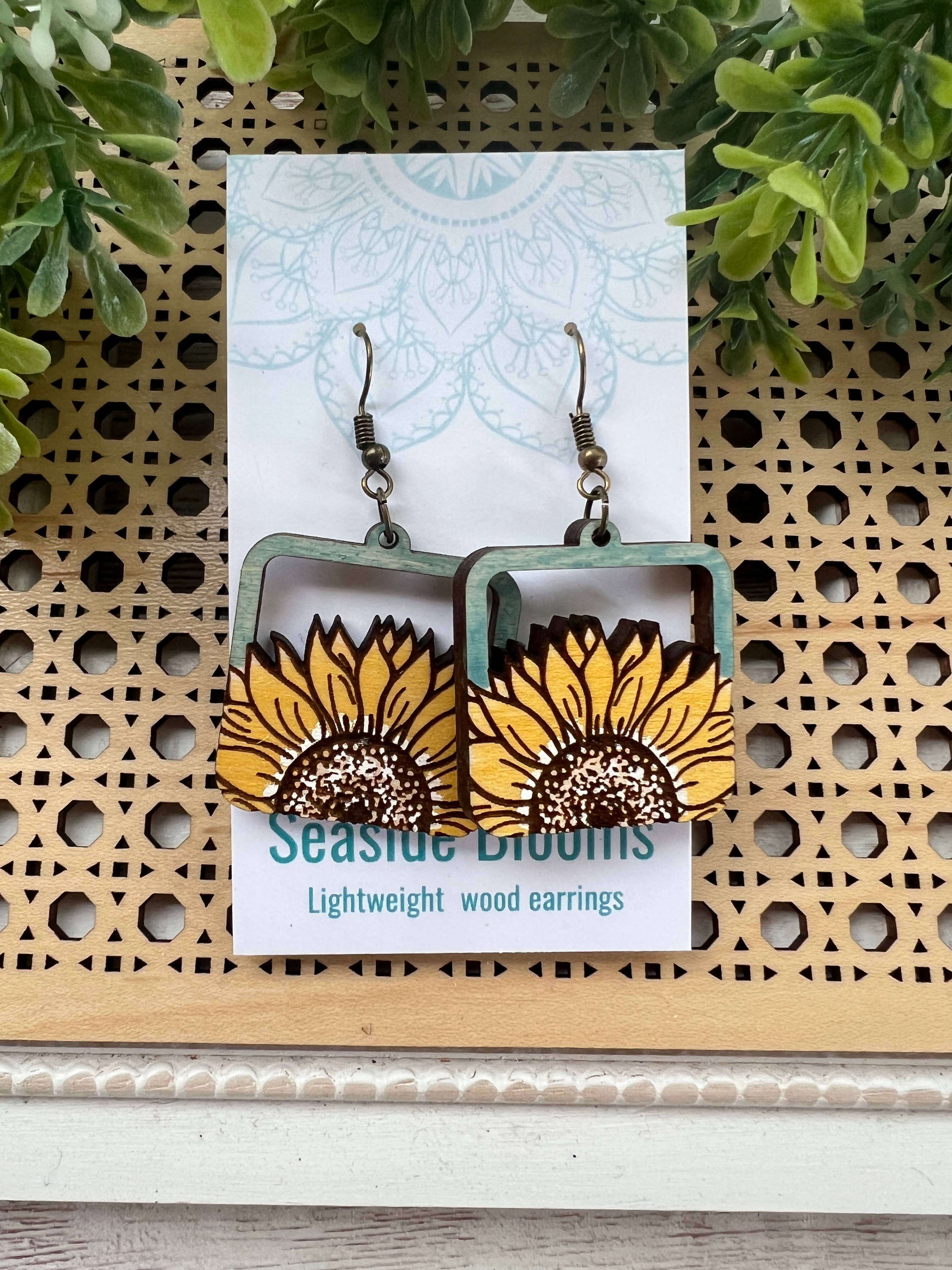 Lightweight boho sunflower earrings made of hand-painted maple wood by Seasideblooms, featuring a natural sunflower design.
