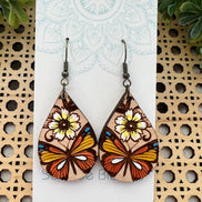 Hand-painted butterfly maple wood earrings by Seasideblooms, lightweight jewelry with colorful butterfly design.