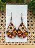 Hand-painted butterfly maple wood earrings by Seasideblooms, lightweight jewelry with colorful butterfly design.