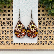 Hand-painted butterfly maple wood earrings by Seasideblooms, lightweight jewelry with colorful butterfly design.
