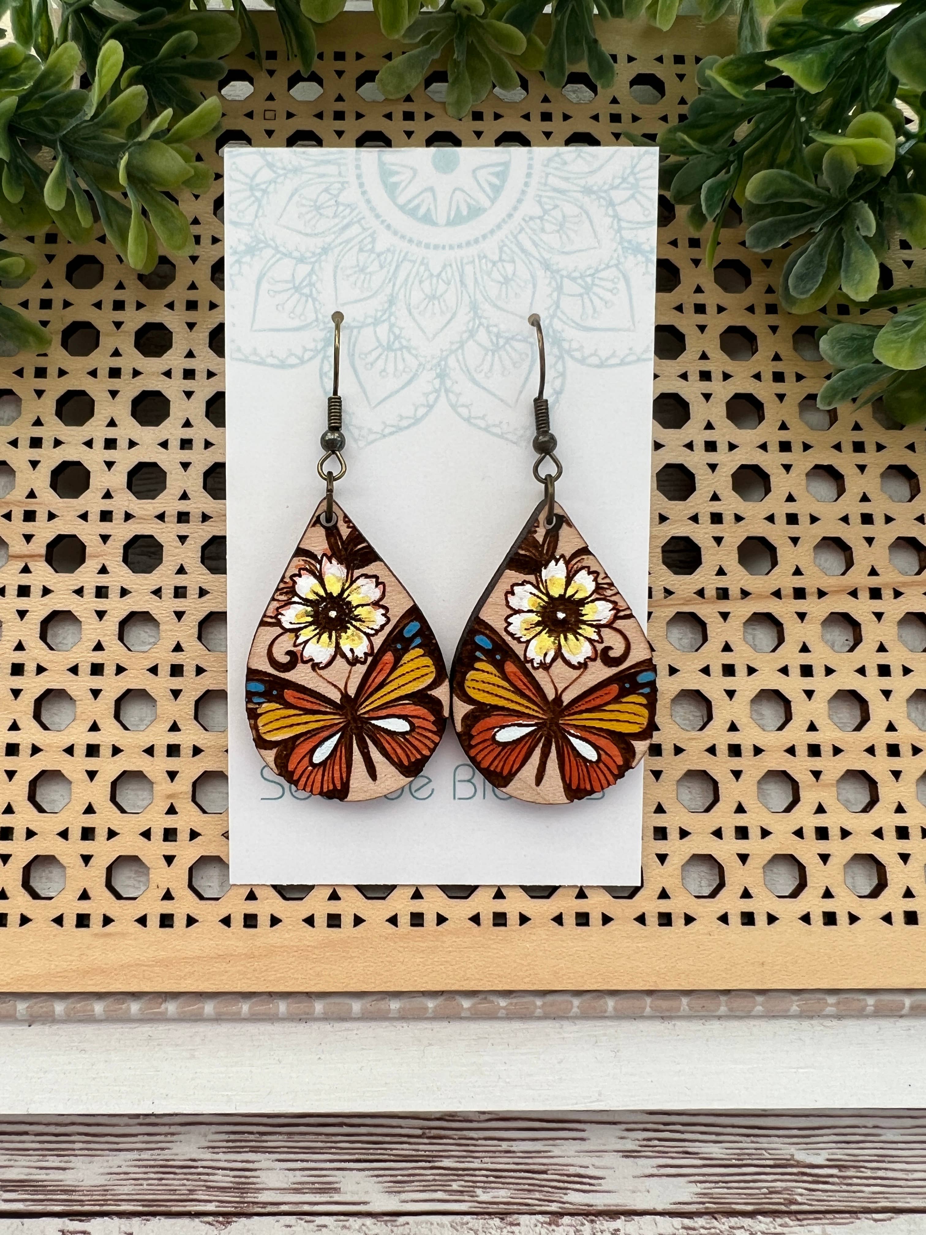 Hand-painted butterfly maple wood earrings by Seasideblooms, lightweight jewelry with colorful butterfly design.
