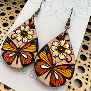 Hand-painted butterfly maple wood earrings by Seasideblooms, lightweight jewelry with colorful butterfly design.