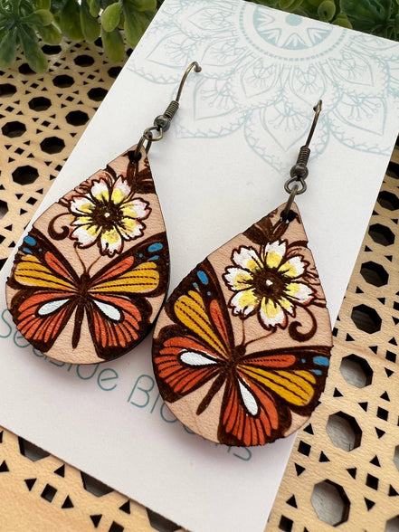 Hand-painted butterfly maple wood earrings by Seasideblooms, lightweight jewelry with colorful butterfly design.