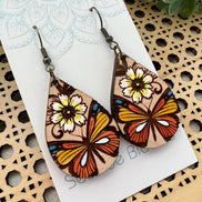 Hand-painted butterfly maple wood earrings by Seasideblooms, lightweight jewelry with colorful butterfly design.