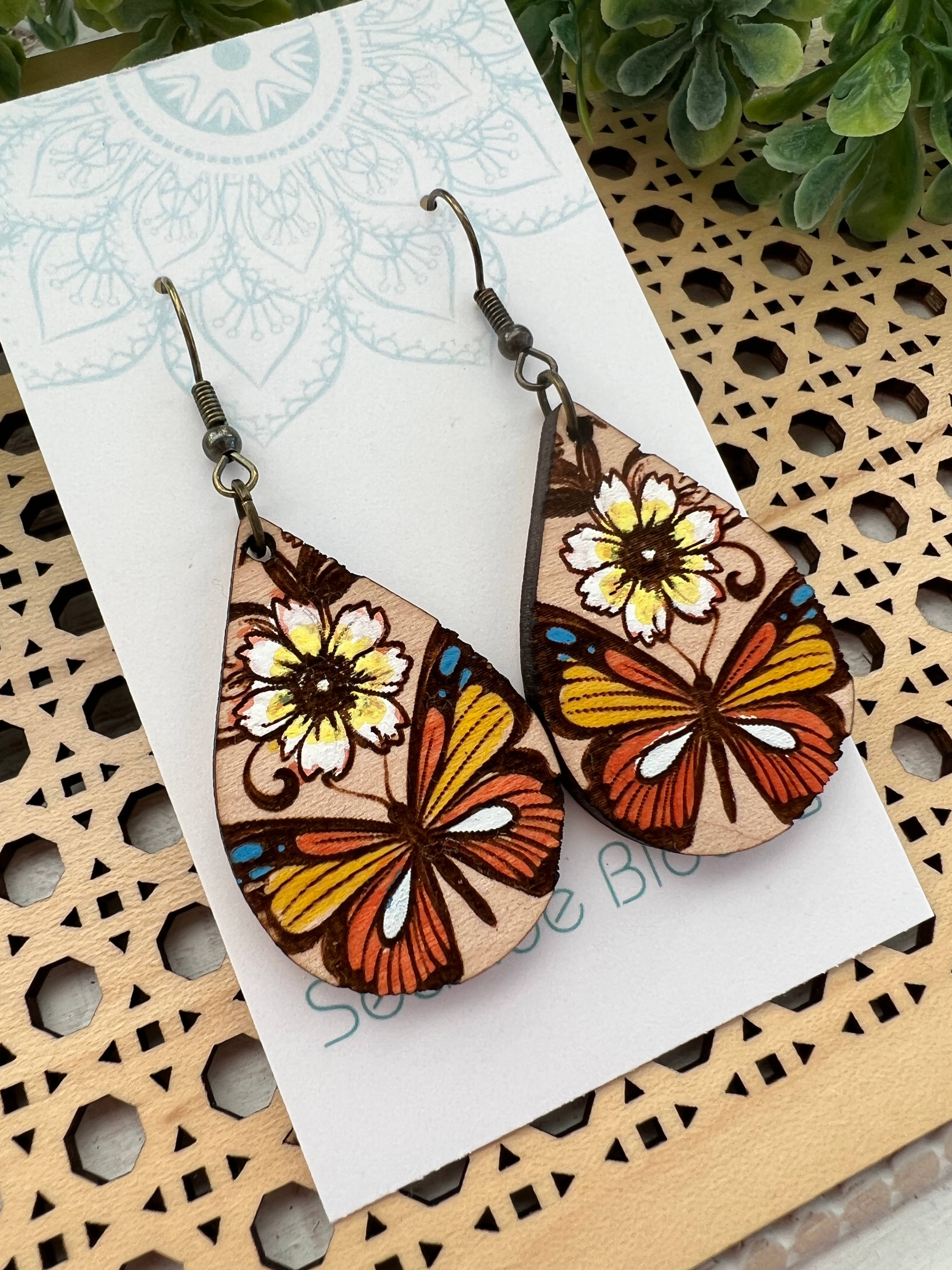 Hand-painted butterfly maple wood earrings by Seasideblooms, lightweight jewelry with colorful butterfly design.