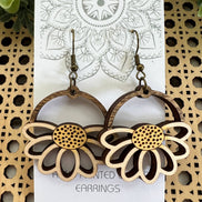 Lightweight Daisy Wood Earrings by Seasideblooms, hand-painted maple wood with floral design, hanging from silver hooks.