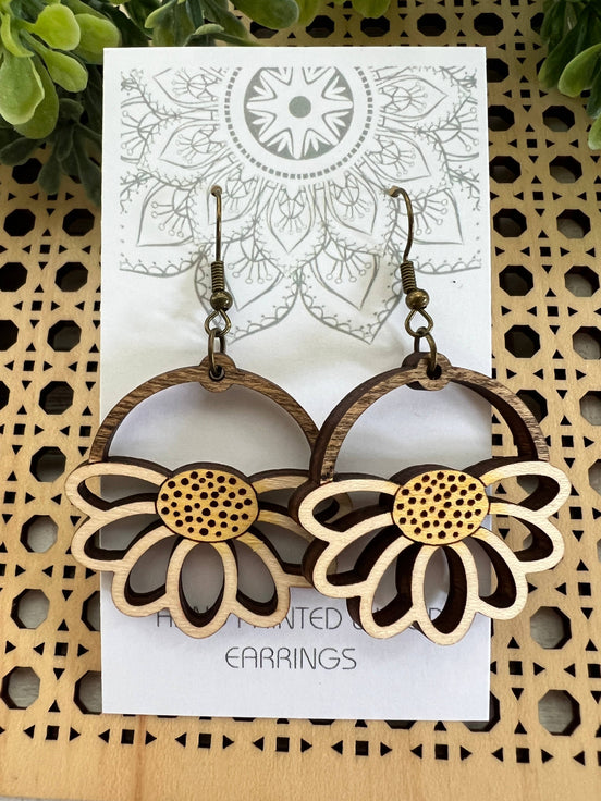 Lightweight Daisy Wood Earrings by Seasideblooms, hand-painted maple wood with floral design, hanging from silver hooks.