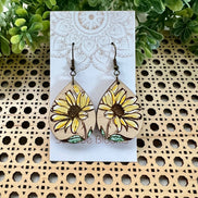 Hand-painted Daisy dangle earring made of lightweight wood with floral design, by Seasideblooms.
