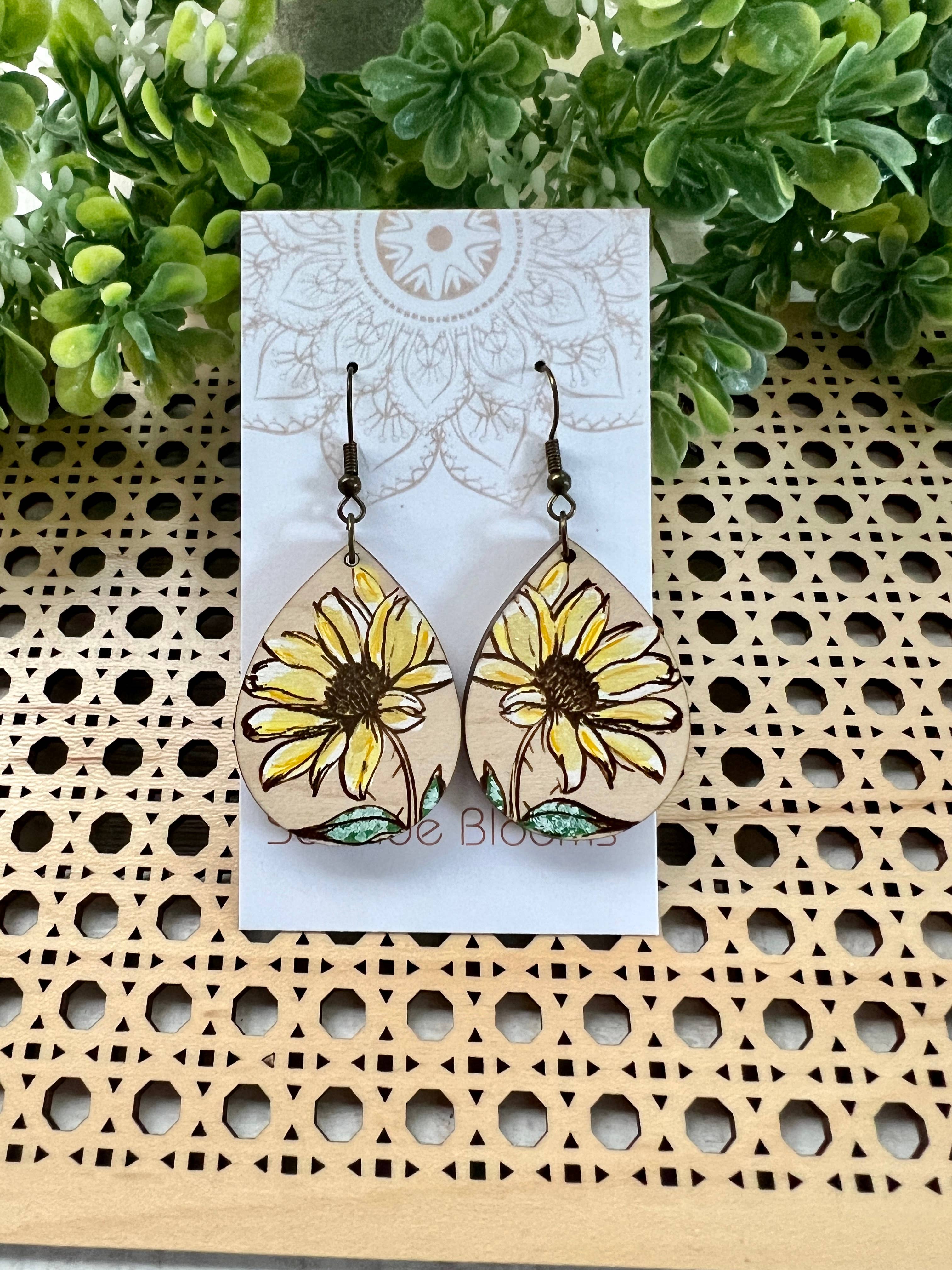 Hand-painted Daisy dangle earring made of lightweight wood with floral design, by Seasideblooms.