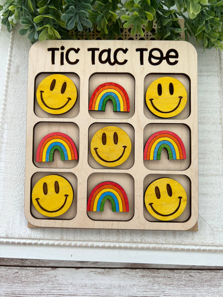 Maple wood Tic Tac Toe board with hand-painted game pieces, crafted by Seasideblooms, featuring intricate painted designs on each piece.