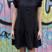 Black mini dress from Shiying Fashion featuring a fitted silhouette and short sleeves, perfect for casual or evening wear.