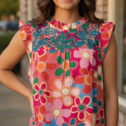 Pink floral blouse by Shiying Fashion featuring lightweight fabric and a feminine floral pattern, perfect for casual or dressy wear.