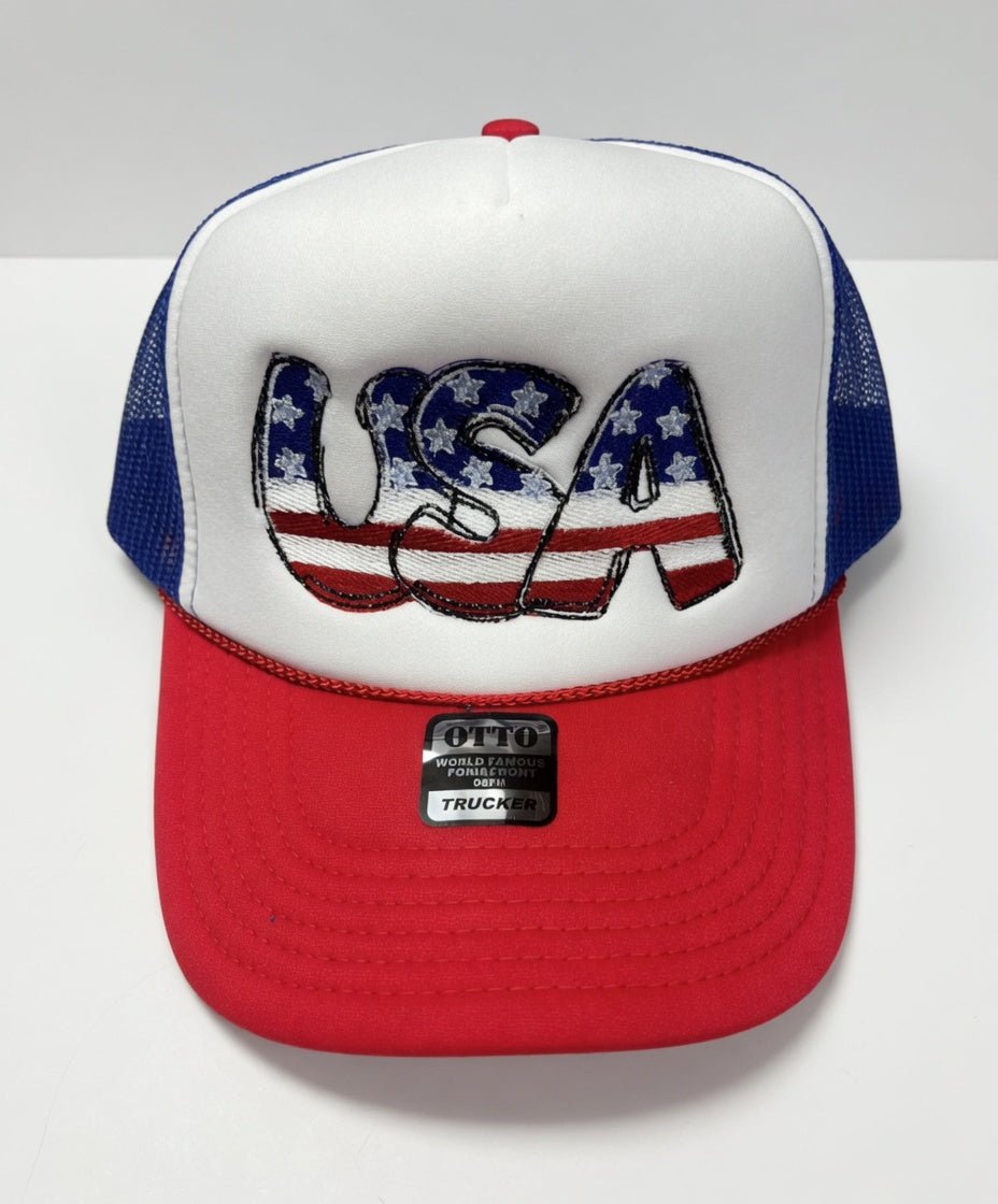 USA embroidered trucker hat by Southern Attitude Designs Inc, featuring patriotic red, white, and blue embroidery with mesh back.