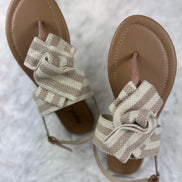 Beige and cream sandals from Stella Shoes featuring open toes and ankle straps, perfect for warm-weather casual wear.