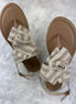 Beige and cream sandals from Stella Shoes featuring open toes and ankle straps, perfect for warm-weather casual wear.