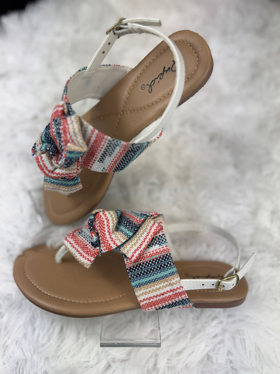 Multicolored Stella Shoes sling back sandals with open toes and ankle straps, featuring vibrant, multicolored woven design.