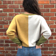 Mustard color block top from Stylish Wholesale featuring long sleeves and a relaxed fit, ideal for casual and stylish outfits.