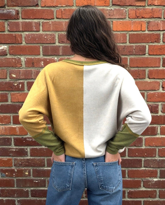 Mustard color block top from Stylish Wholesale featuring long sleeves and a relaxed fit, ideal for casual and stylish outfits.