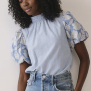TCEC puff sleeve top featuring soft fabric, stylish puffed sleeves, and a fitted silhouette, perfect for casual or dressy occasions.