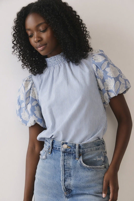 TCEC puff sleeve top featuring soft fabric, stylish puffed sleeves, and a fitted silhouette, perfect for casual or dressy occasions.