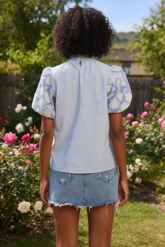 TCEC puff sleeve top featuring lightweight fabric and feminine design, with puffed sleeves and a fitted silhouette.