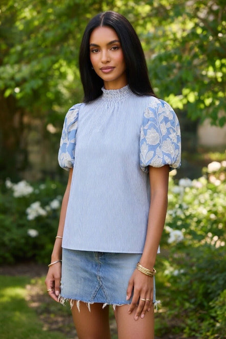 TCEC puff sleeve top featuring airy fabric, stylish puffed sleeves, and a fitted silhouette for a trendy, feminine look.