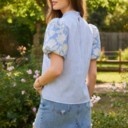 TCEC puff sleeve top featuring short, voluminous sleeves and a fitted bodice, perfect for casual or dressy occasions.
