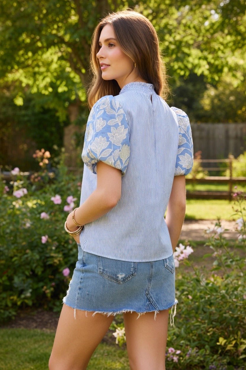 TCEC puff sleeve top featuring short, voluminous sleeves and a fitted bodice, perfect for casual or dressy occasions.