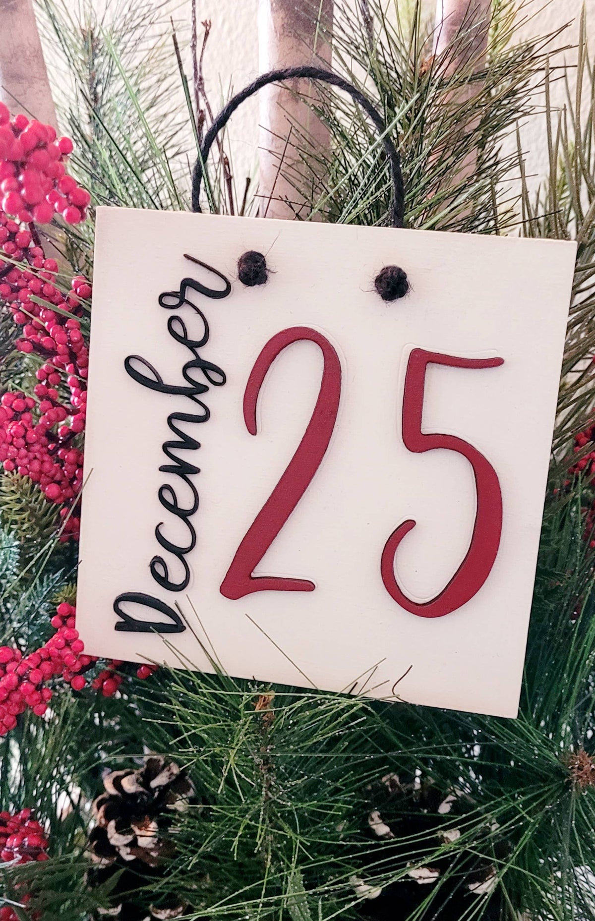 Red December 25th novelty sign by The Country Roost with festive holiday decor and bold lettering for seasonal display.