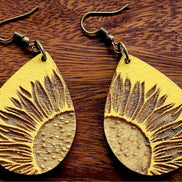 Sunflower teardrop earrings by The Country Roost, gold-tone jewelry with sunflower-shaped dangles and intricate details.