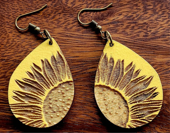 Sunflower teardrop earrings by The Country Roost, gold-tone jewelry with sunflower-shaped dangles and intricate details.