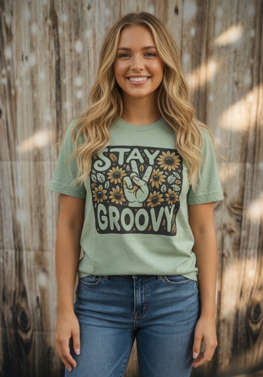 Stay Groovy sunflower peace sign graphic T-shirt from The Lyrical Spirit, LLC featuring a colorful sunflower and peace symbol design.