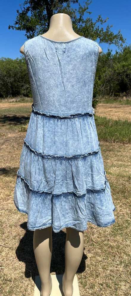 Denim sundress by Vanilla Monkey featuring a casual sleeveless design and adjustable straps, shown on a model.