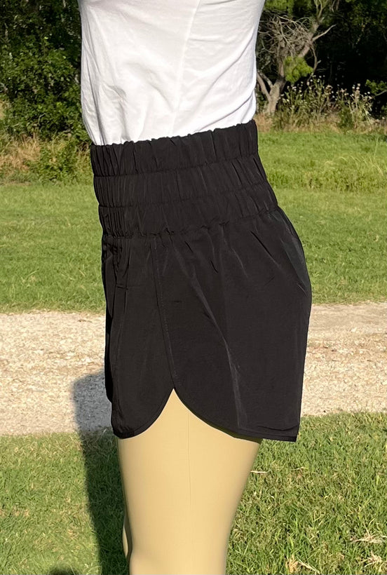 Light gray 42POPS windbreaker track shorts with an elastic waistband and lightweight fabric, designed for athletic wear.