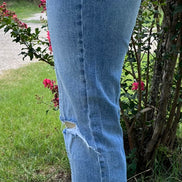 KanCan capris in denim, featuring a slim fit design with classic five-pocket styling and rolled hems.