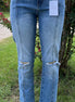 Pair of KanCan capris with a slim fit, featuring classic denim style and visible stitching, perfect for casual wear.