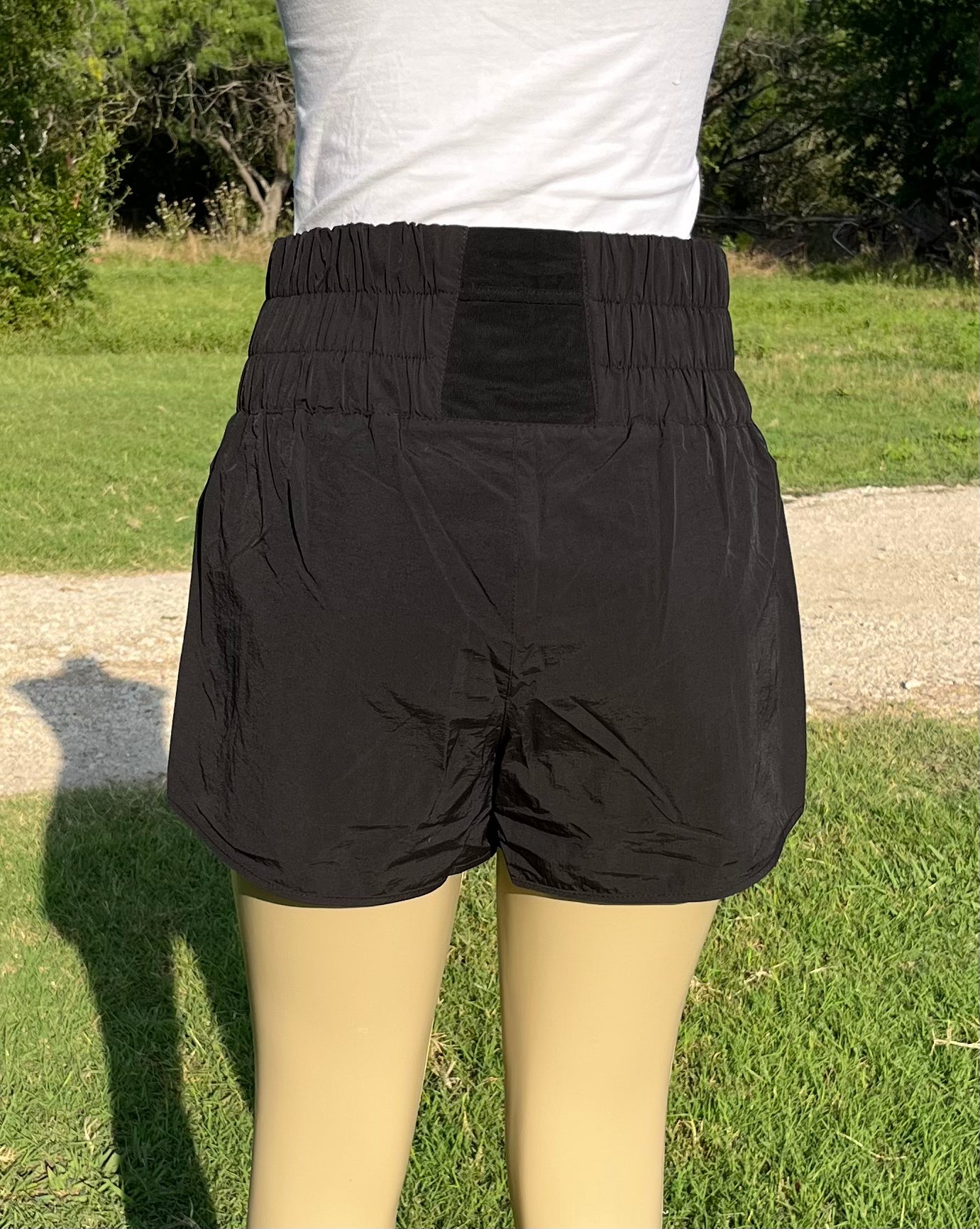 Light gray Windbreaker Track Shorts by 42POPS, featuring a sleek design and elastic waistband suited for athletic wear.