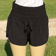 42POPS windbreaker track shorts in black with elastic waistband and side pockets, suitable for running and casual wear.