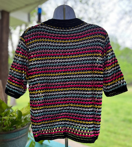 Colorful striped top by Miss Sparkling featuring a stylish design and comfortable fit, shown on a model.